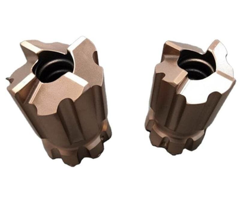 Close-up of a buton bit with scratches and chips