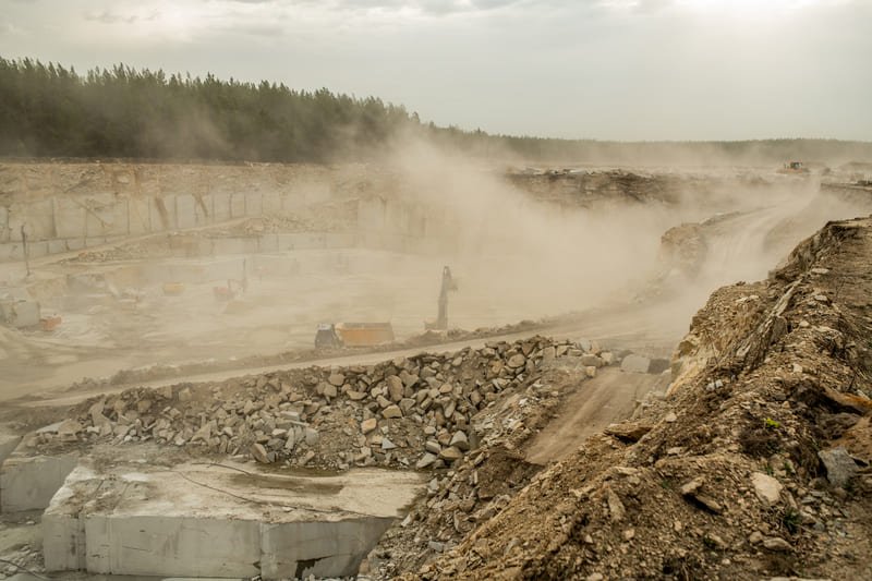 DTH drilling scene emphasizing dust control strategies, promoting safety and environmental protection during operations.