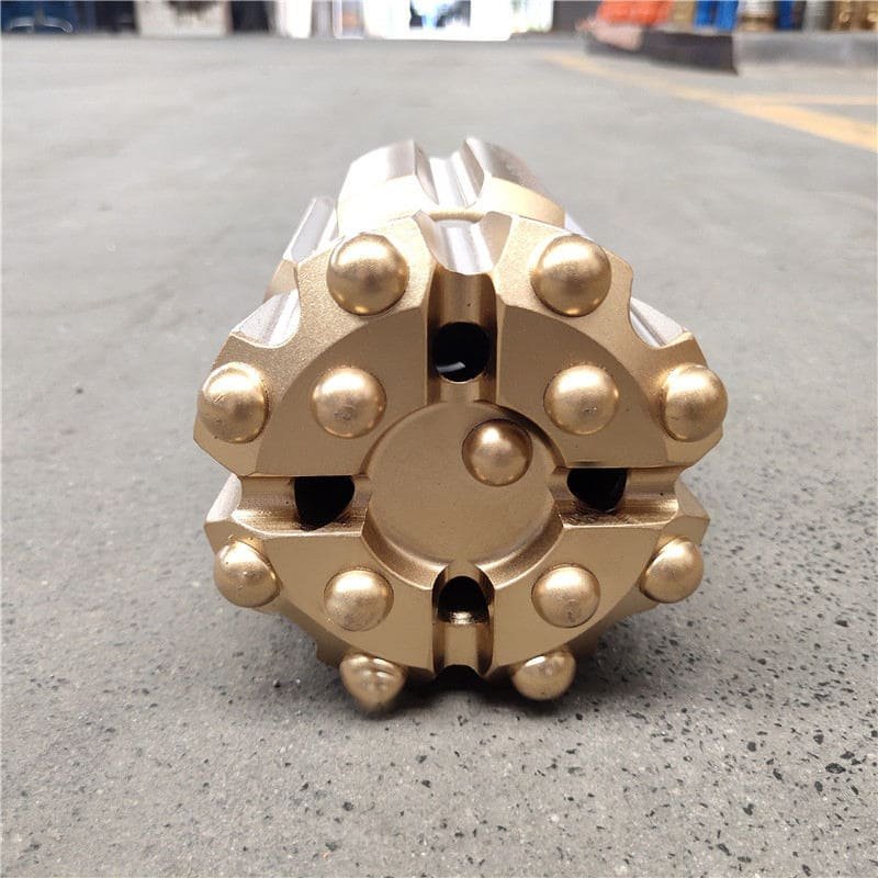 Close-up of various drilling buttons on a rock surface