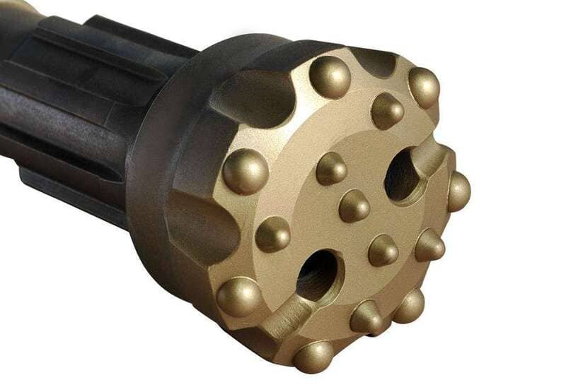 Close-up of a rugged DTH drill bit with flushing holes