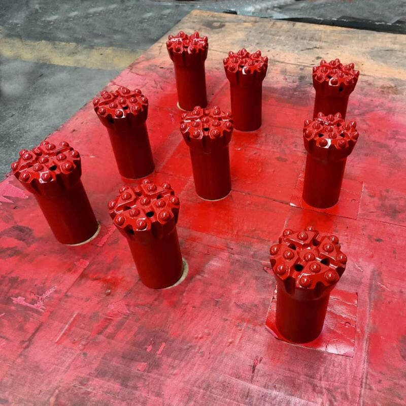 A collection of vibrant red buttons in various sizes and styles
