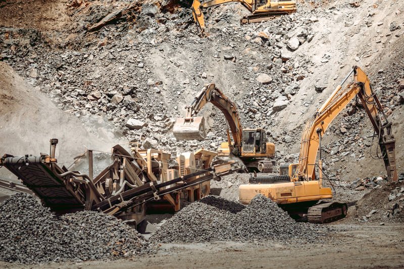 A DTH drill bit in action at a mining site