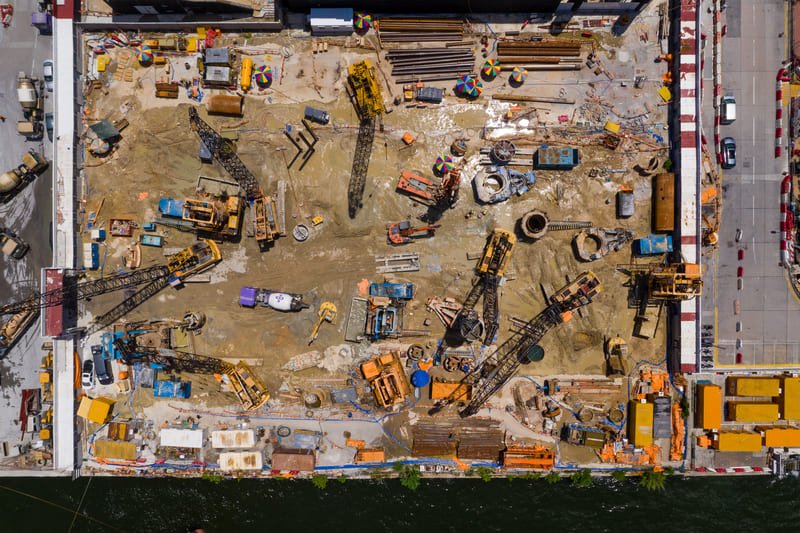 Close-up of a DTH drill bit in action at a construction site