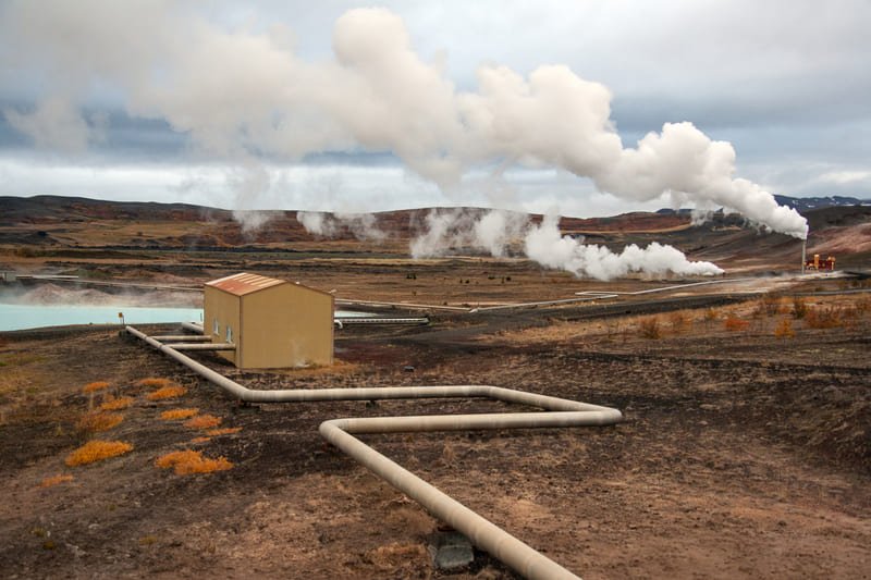 DTH drill bit operating in a geothermal energy site