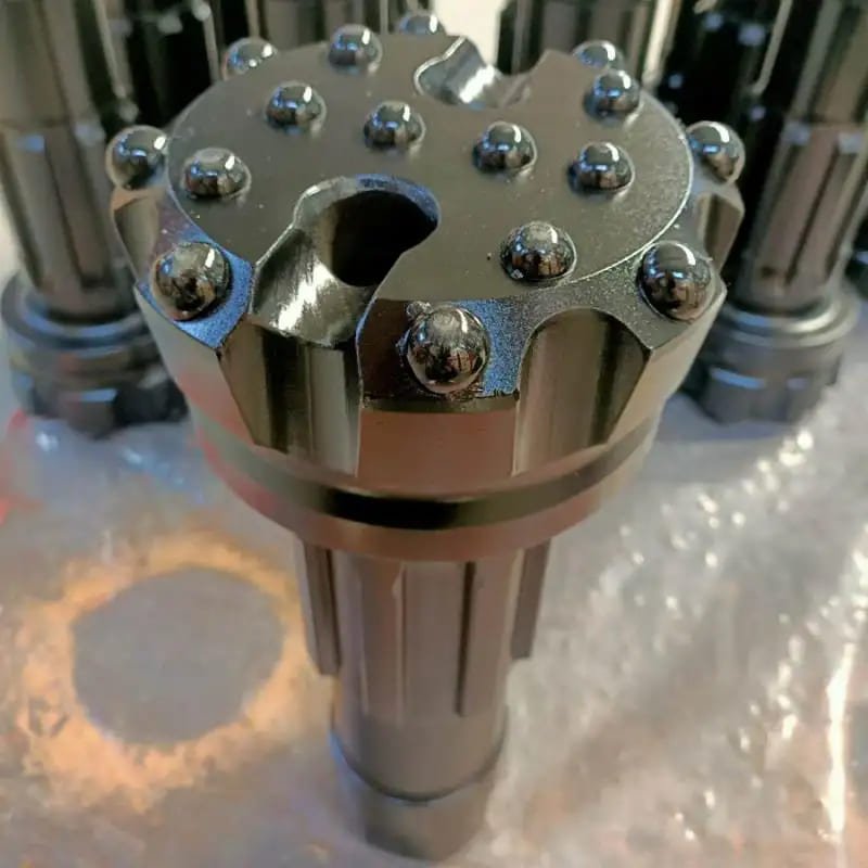 Close-up of customized drill bits on a metallic surface
