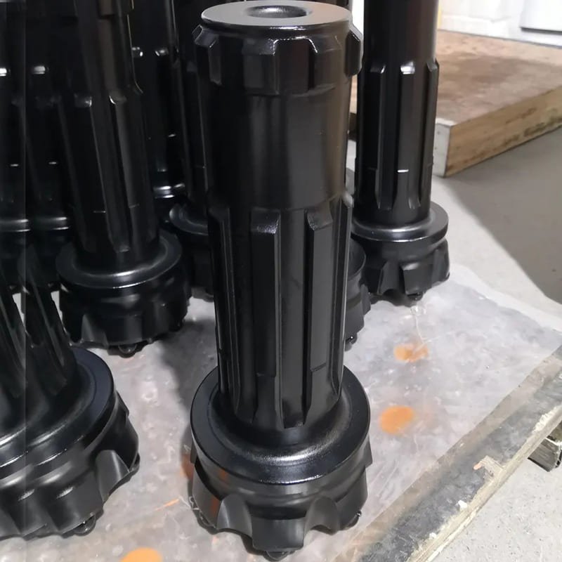 Black DTH drill bits designed for efficient drilling in various geological conditions, showcasing durability and precision.