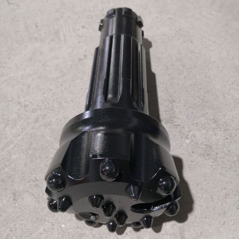 A black DTH drill bit designed for efficient drilling in various geological conditions.