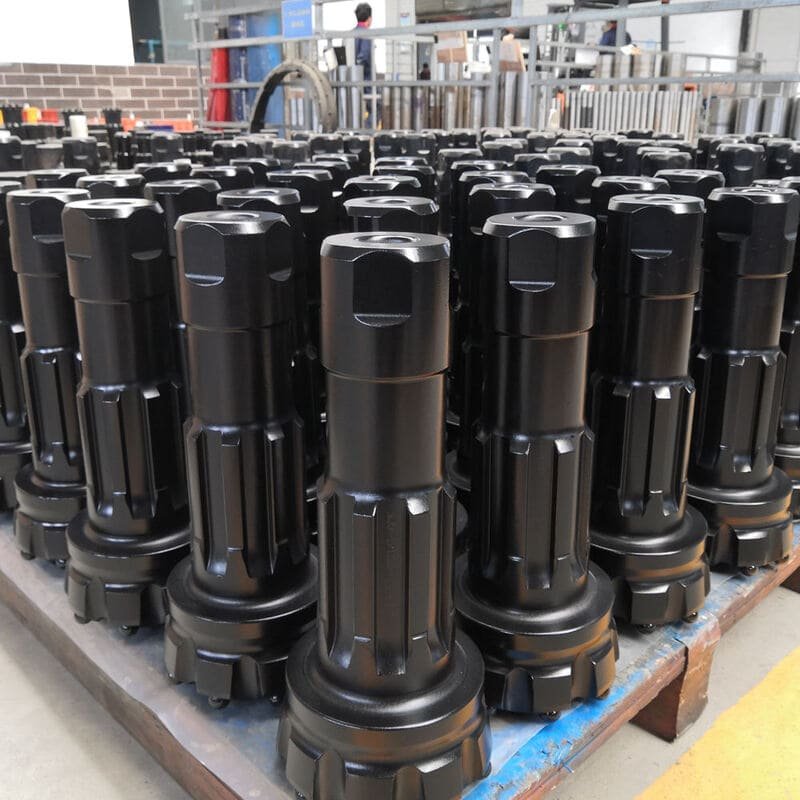 Close-up view of a DTH drilling bit, showcasing its intricate design and sharp cutting edges for efficient drilling.