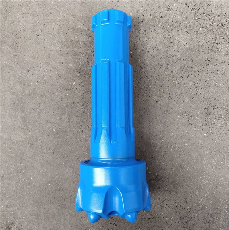 Close-up of blue DTH drill bits, showcasing their intricate design and sharp edges for efficient drilling performance.
