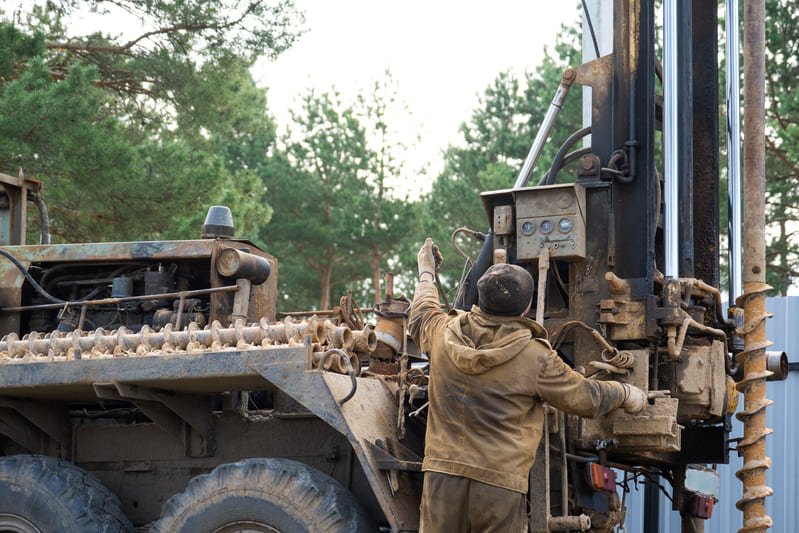 A drilling rig operates on-site