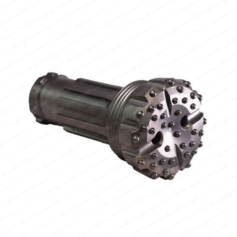 A DTH drill bit in action at a drilling site