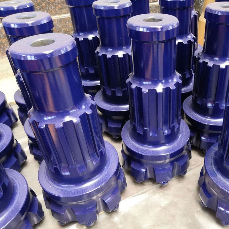 Detailed close-up of a purple DTH bit