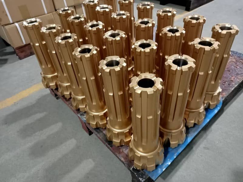 DTH drill bit embedded in hard rock