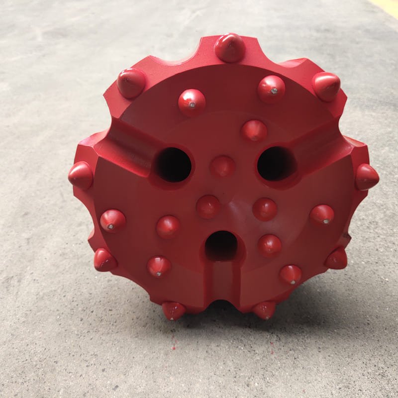 A flat face DTH bit designed for efficient drilling, featuring a robust construction and precision-engineered cutting edges.